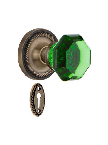 Rope Rosette Mortise Lock Set with Colored Waldorf Crystal Glass Knobs Emerald in Antique Brass.